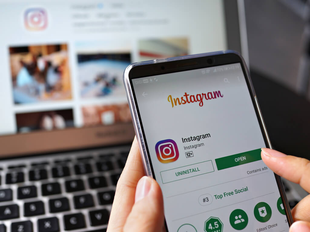 a person logging into Instagram on a mobile phone