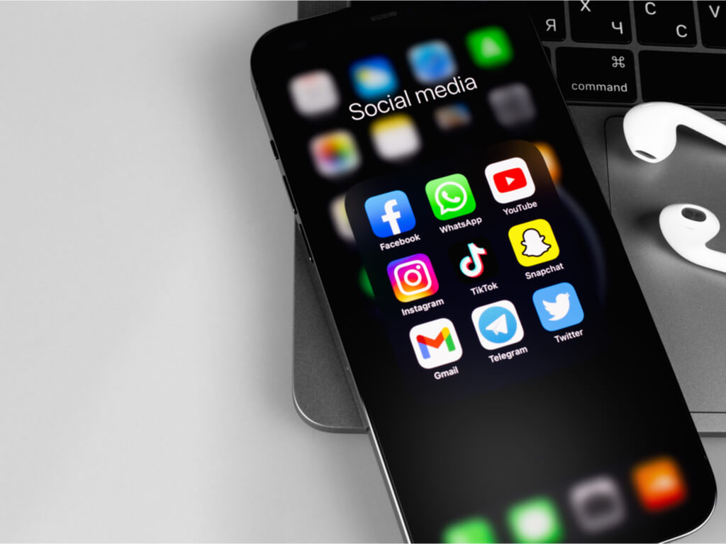 a smartphone displaying social media platforms
